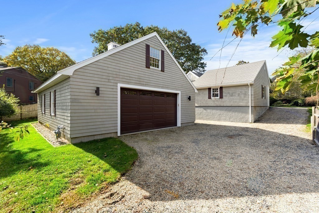 22 Arrowhead Road Marblehead, MA 01945 - Photo 26 of 34 a front view of a house with a yard and garage