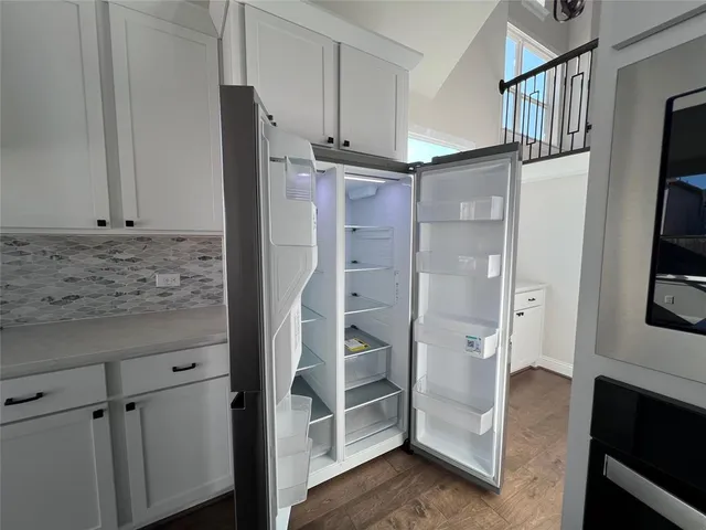a bathroom with a shower and a glass door