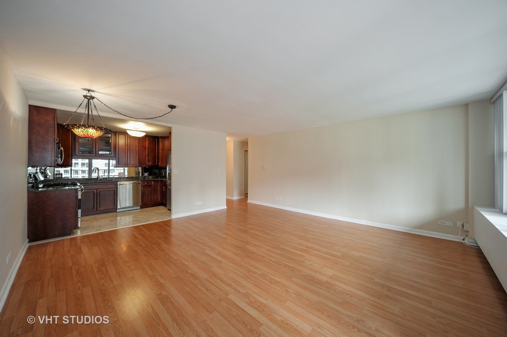400 East Randolph Street, Unit 1924 Chicago, IL 60601 - Photo 3 of 18 a view of kitchen with wooden floor
