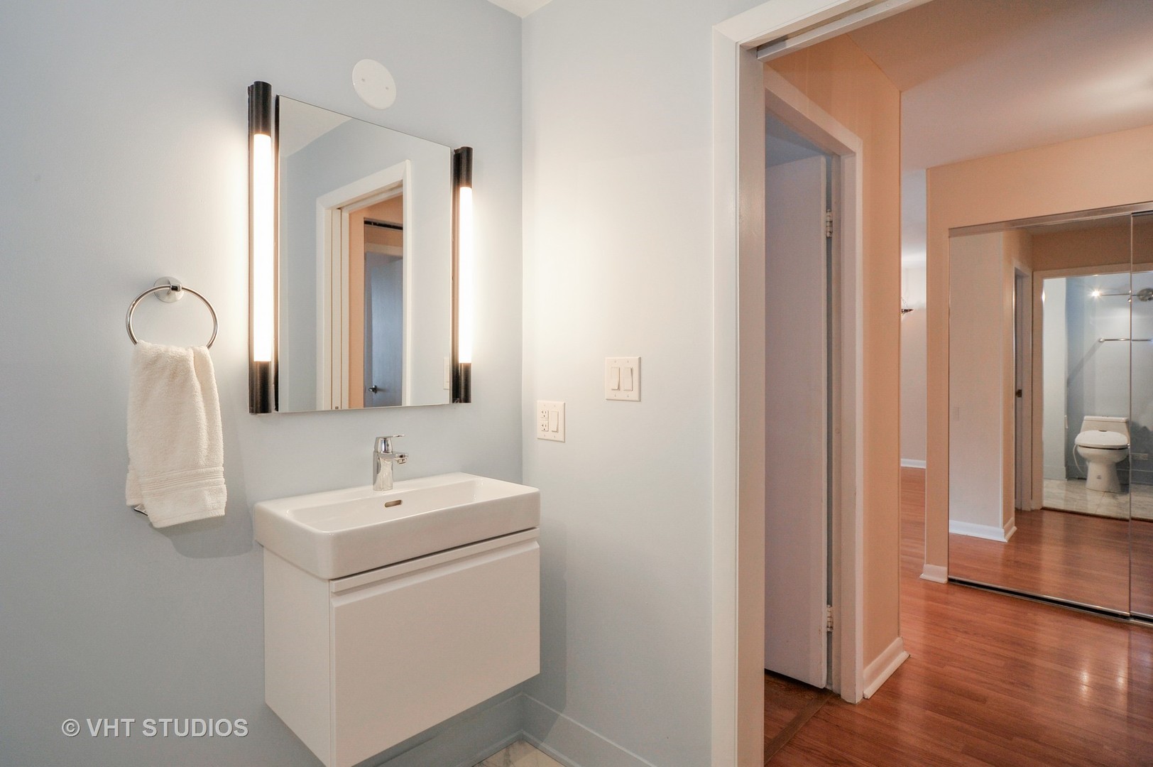 400 East Randolph Street, Unit 1924 Chicago, IL 60601 - Photo 7 of 18 a bathroom with a sink and a mirror