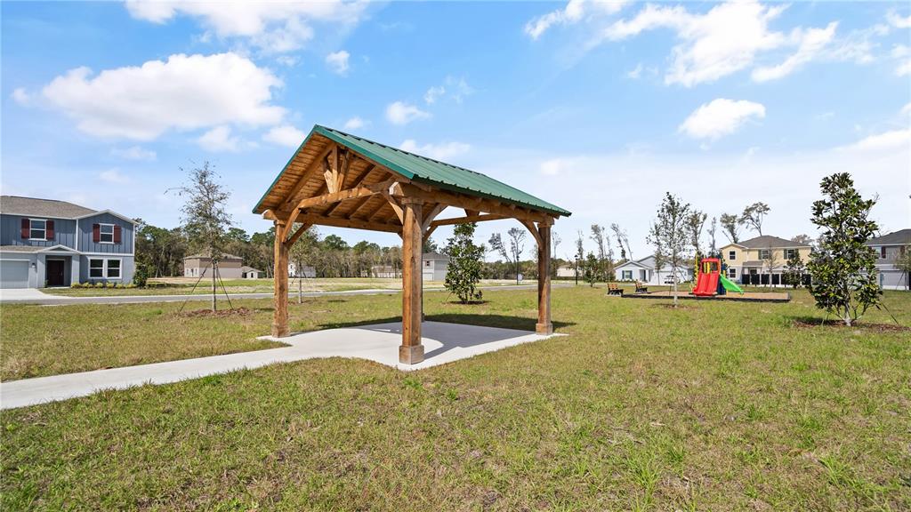 1394 Inkberry Circle DeLand, FL 32720 - Photo 20 of 26 a view of a playground and basketball court