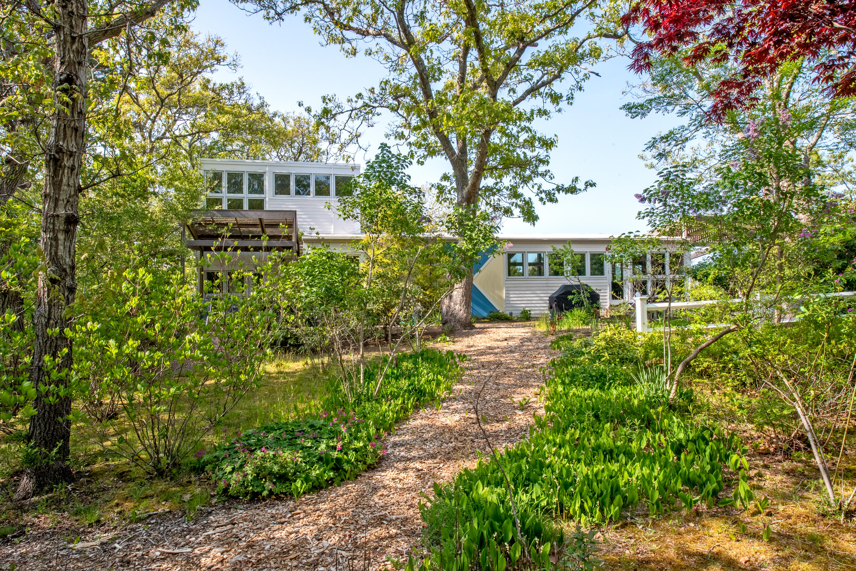30 Gulch Road Wellfleet, MA 02667 - Photo 7 of 41 a view of a house with a yard and sitting area