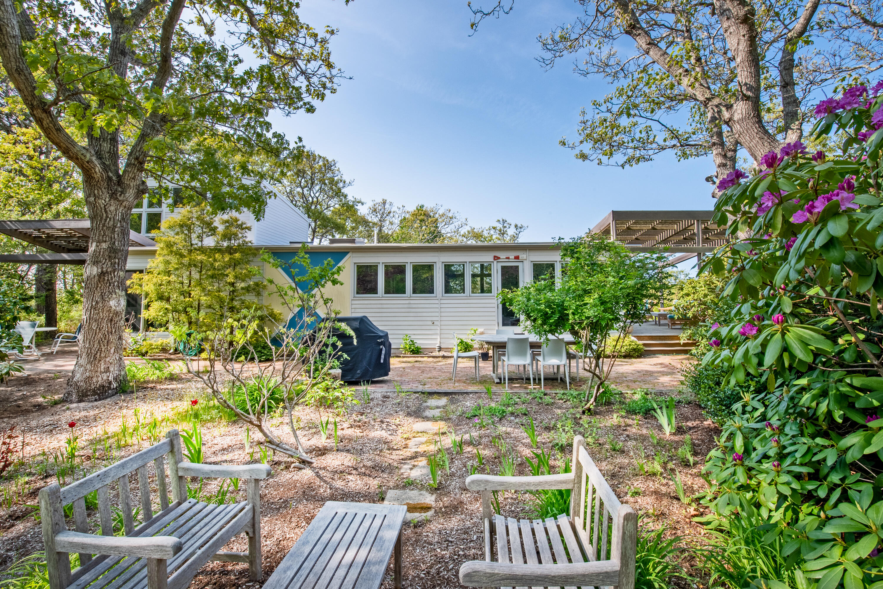 30 Gulch Road Wellfleet, MA 02667 - Photo 8 of 41 a view of a house with backyard and sitting area