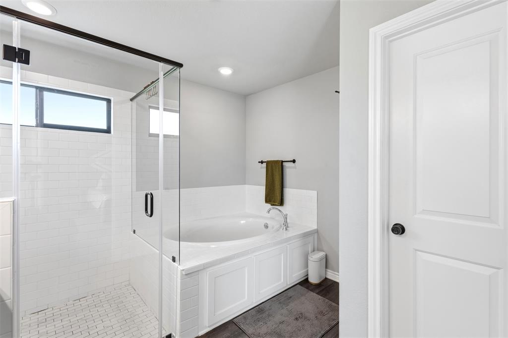 2990 Wilson Road Palmer, TX 75152 - Photo 33 of 40 a white bath tub sitting next to a white sink and vanity