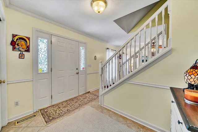 a living room with furniture tv and a flat screen tv
