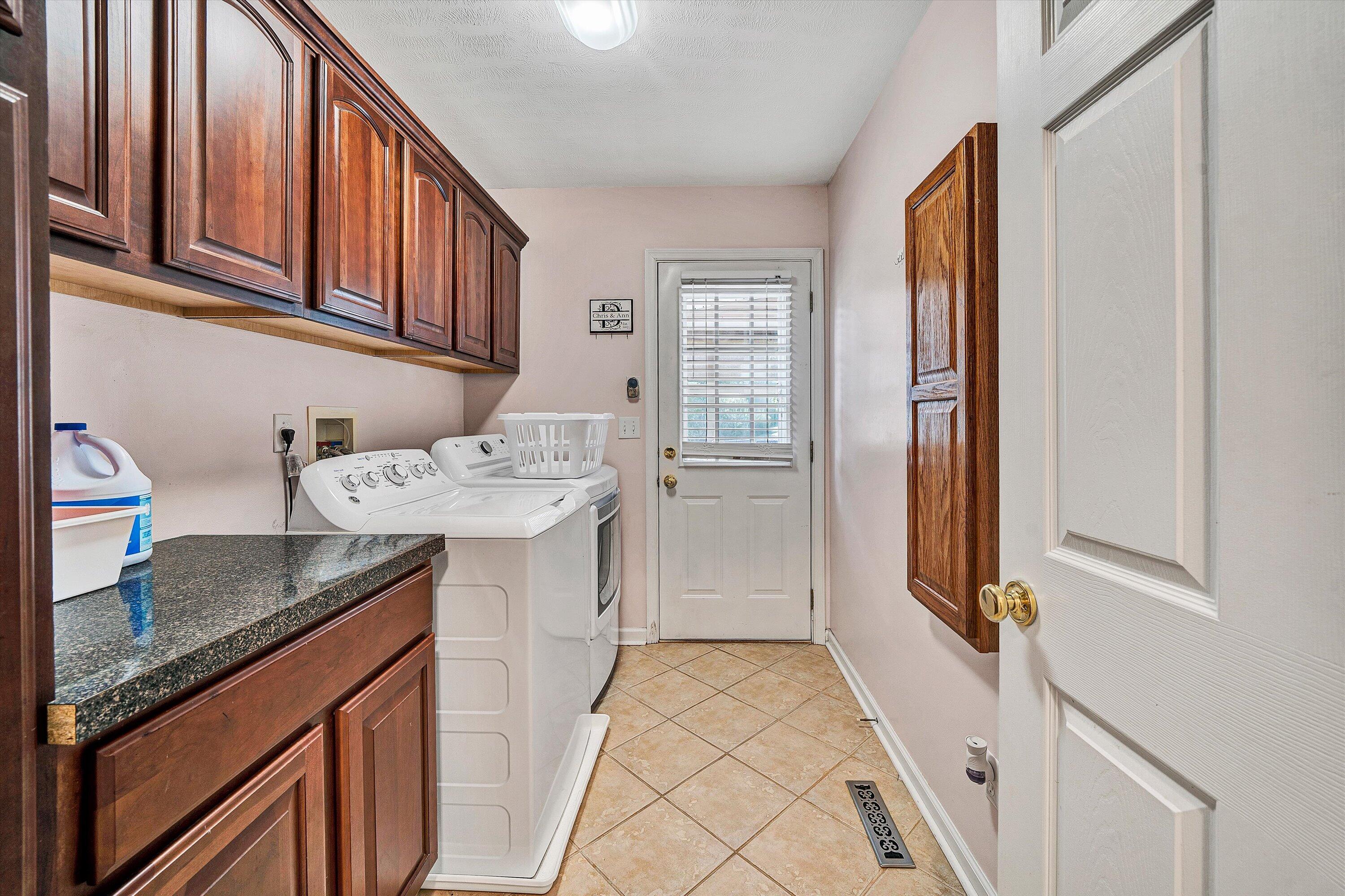 1670 Forge Road Lexington, VA 24450 - Photo 17 of 65 a kitchen with stainless steel appliances granite countertop a sink stove and cabinets