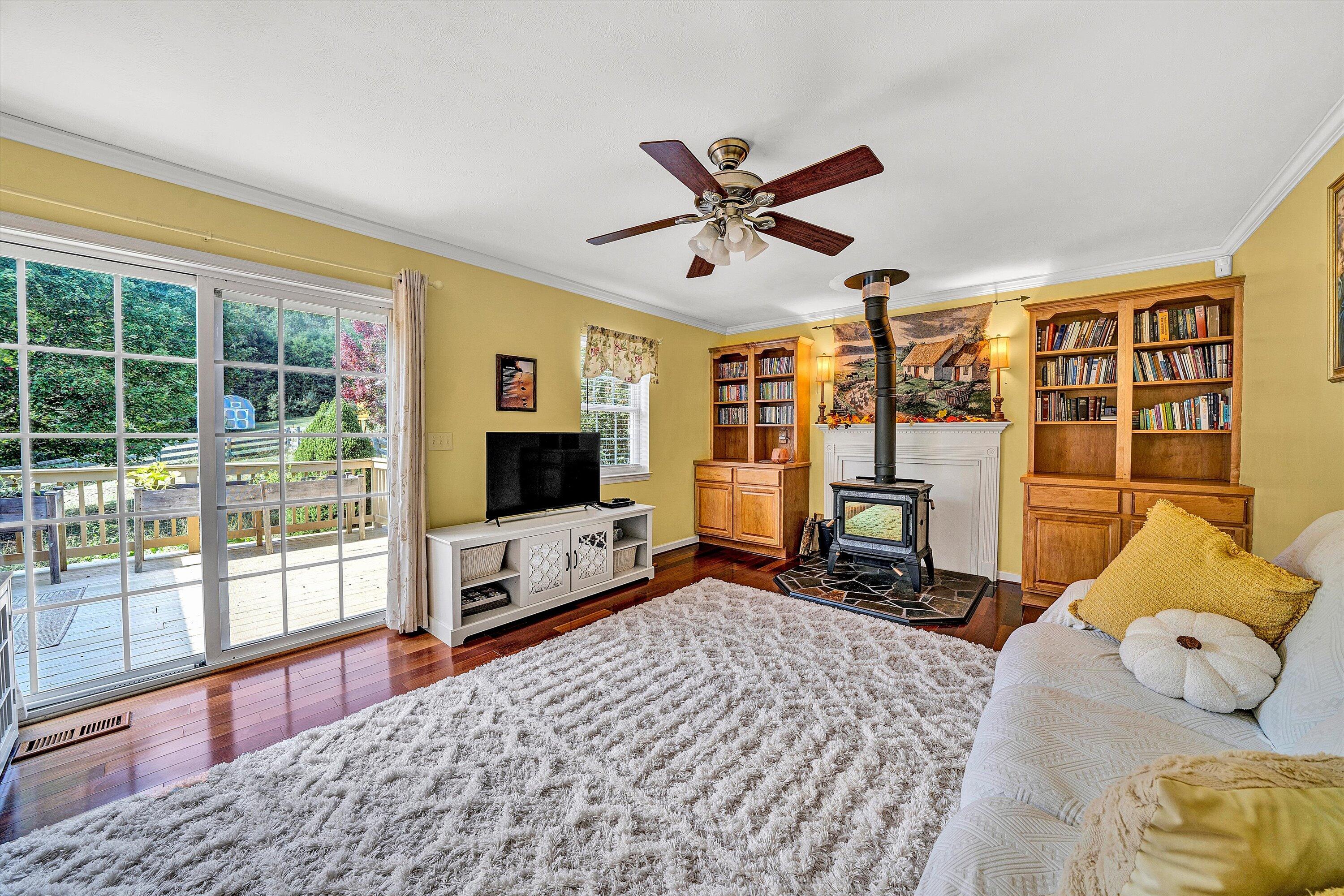 1670 Forge Road Lexington, VA 24450 - Photo 28 of 65 a living room with furniture tv and a flat screen tv