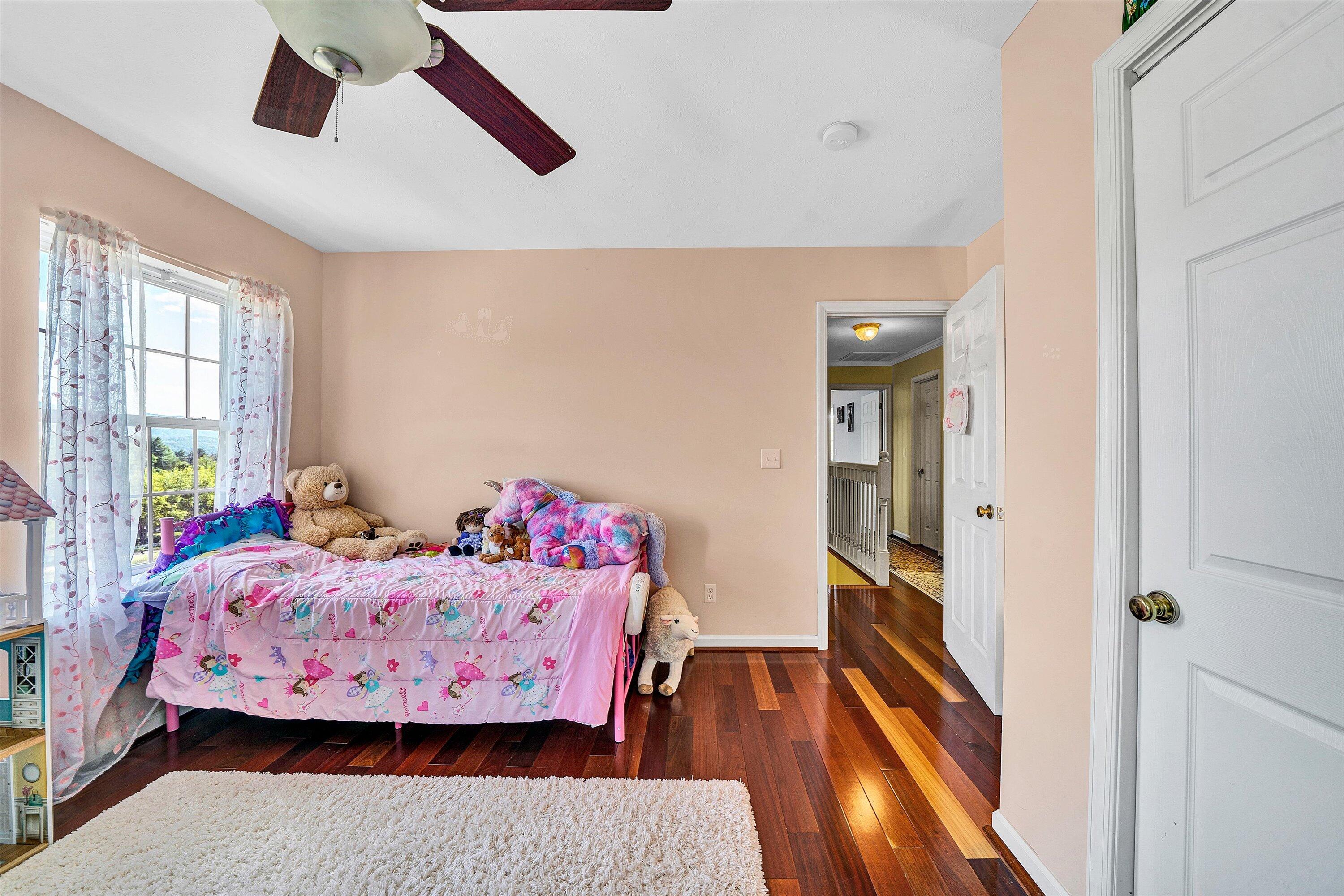 1670 Forge Road Lexington, VA 24450 - Photo 33 of 65 a bedroom with a bed and wooden floor