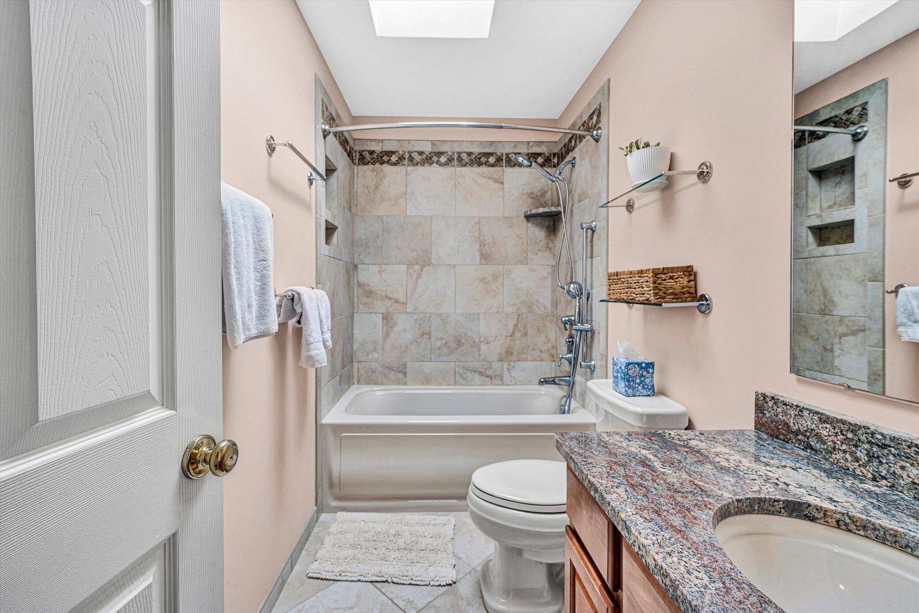 1670 Forge Road Lexington, VA 24450 - Photo 34 of 65 a bathroom with a granite countertop sink toilet and shower