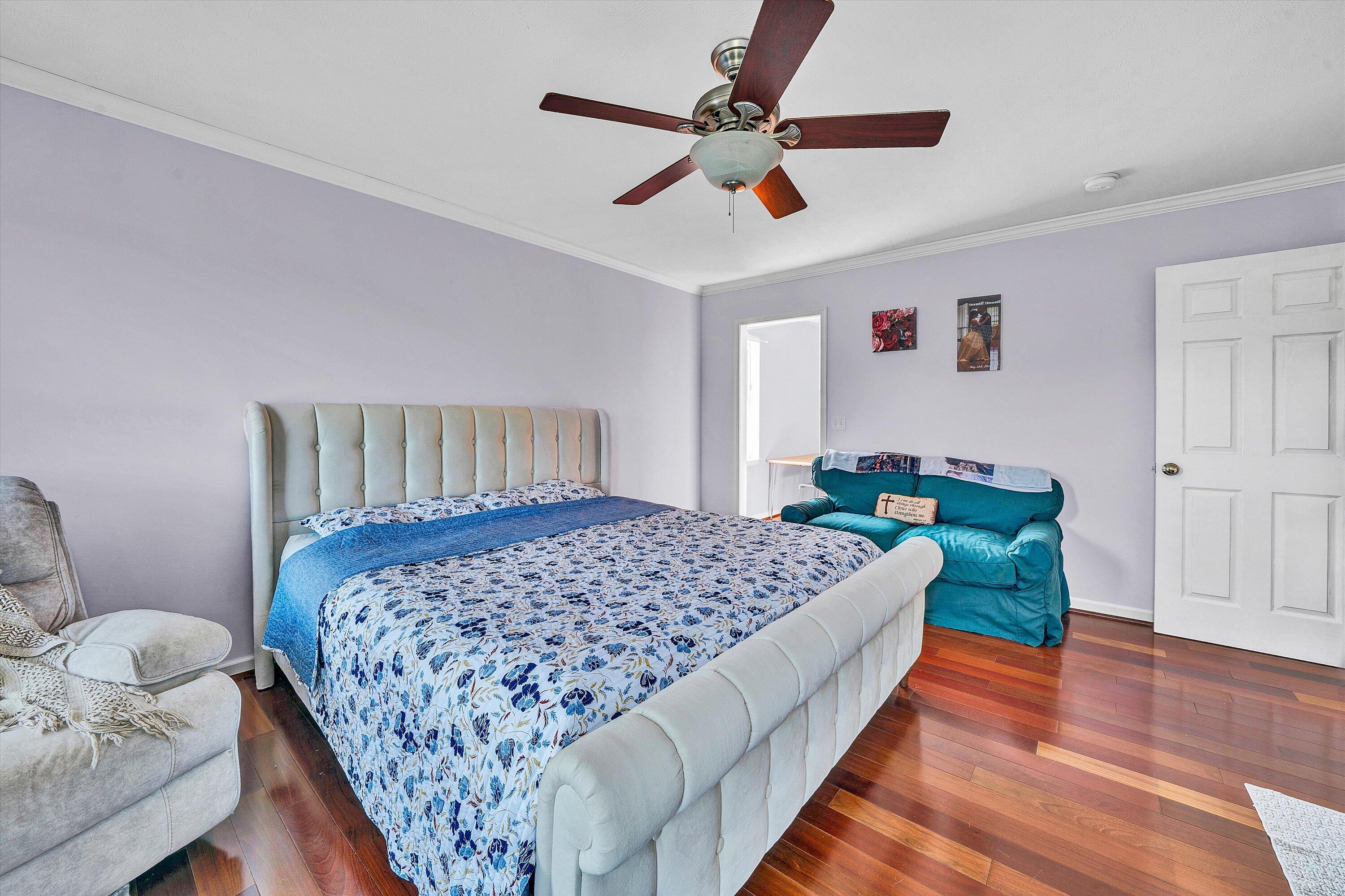 1670 Forge Road Lexington, VA 24450 - Photo 36 of 65 a bedroom with a bed and a chandelier