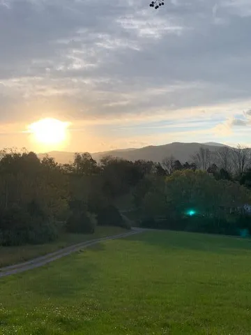 a view of a livingroom with furniture and a workspace