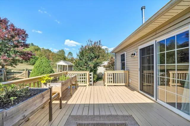 a view of a livingroom with furniture and a window