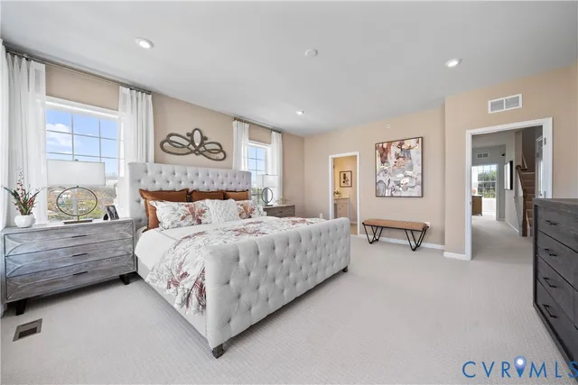 a bedroom with bed and a window