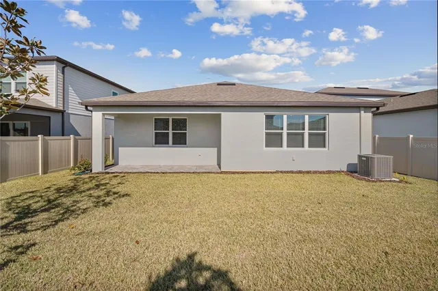 a house with swimming pool in front of it