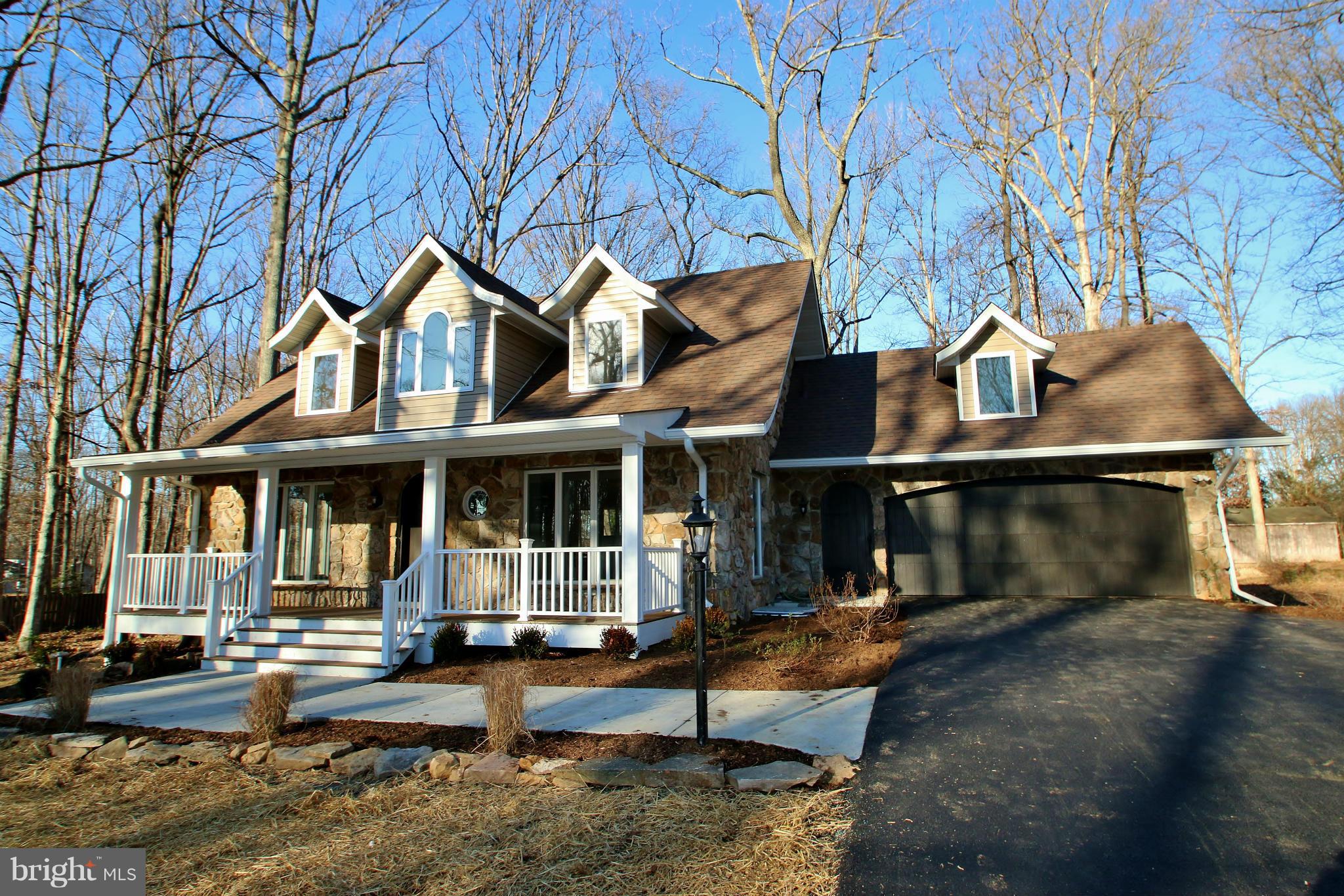 a view of a house with wooden fence