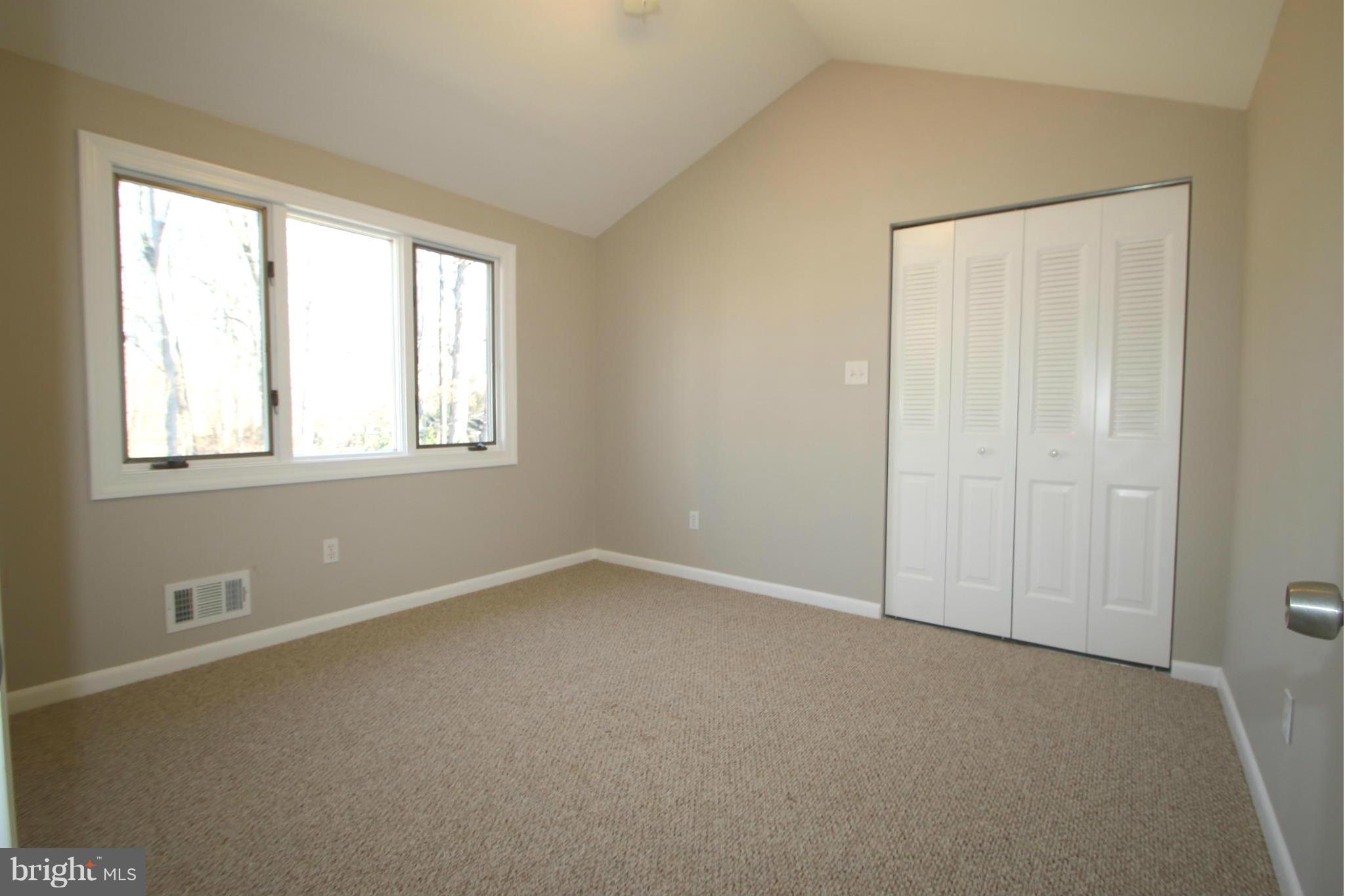 4321 Oaktree Road Rockville, MD 20853 - Photo 11 of 24 an empty room with windows and closet