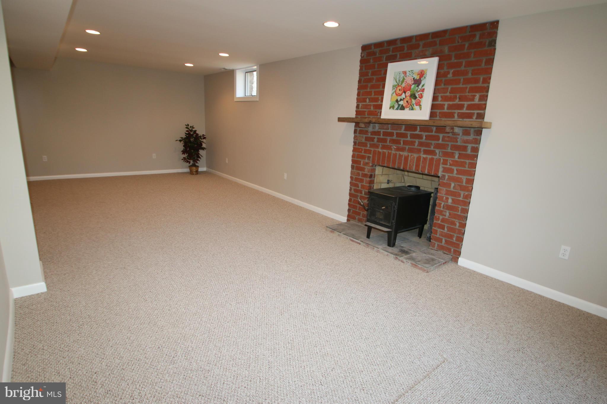 4321 Oaktree Road Rockville, MD 20853 - Photo 15 of 24 a view of an empty room with a fireplace