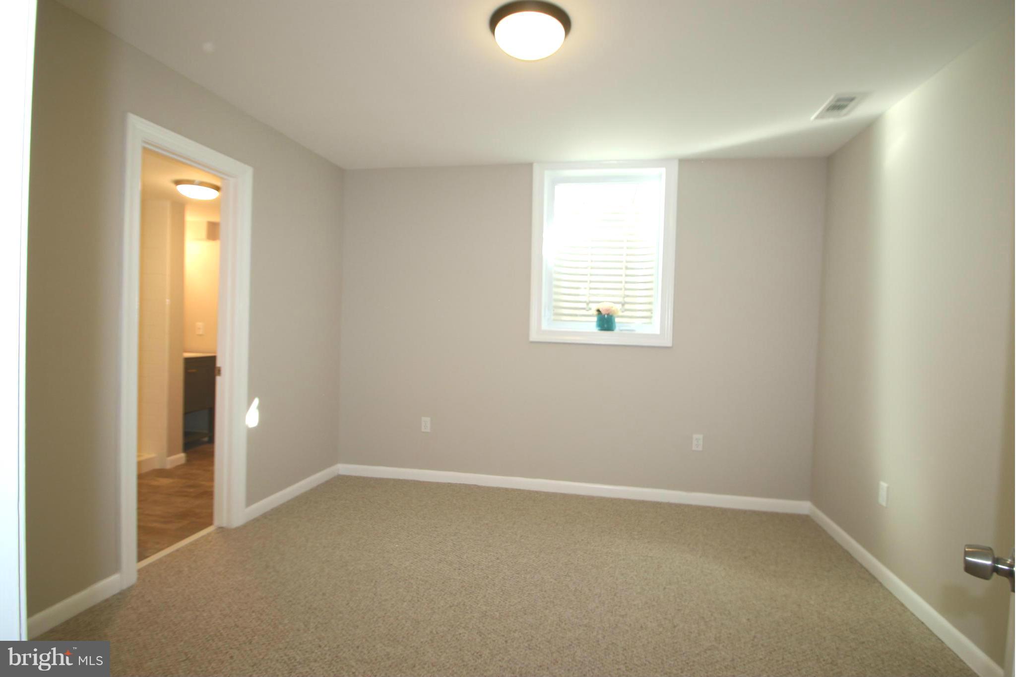 4321 Oaktree Road Rockville, MD 20853 - Photo 16 of 24 a view of an empty room with a window