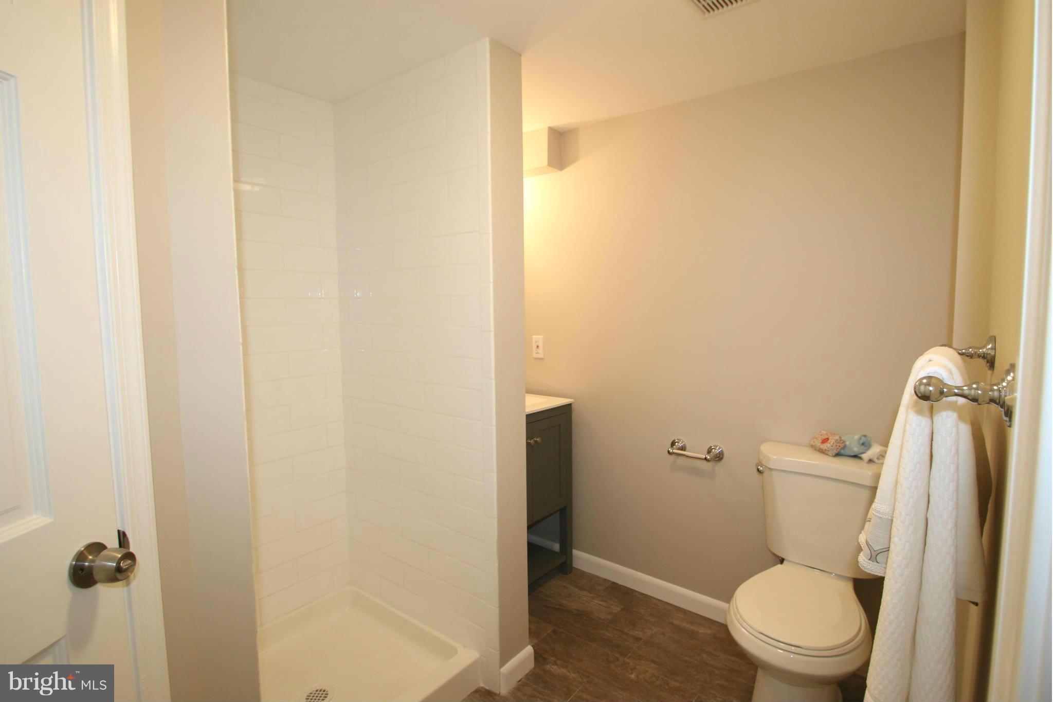 4321 Oaktree Road Rockville, MD 20853 - Photo 17 of 24 a white toilet sitting next to a shower