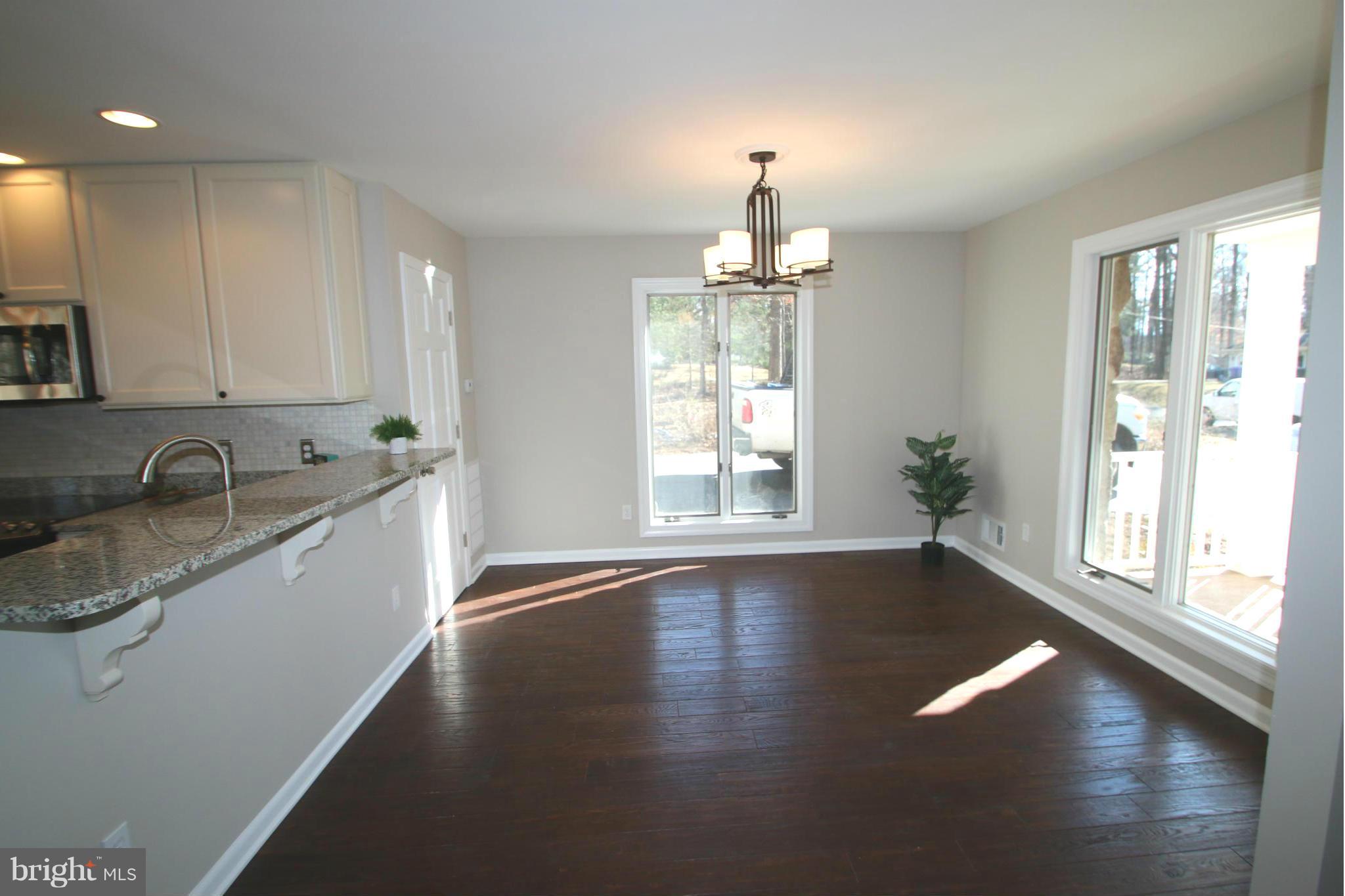 4321 Oaktree Road Rockville, MD 20853 - Photo 5 of 24 a view of a kitchen with a sink dishwasher and a window