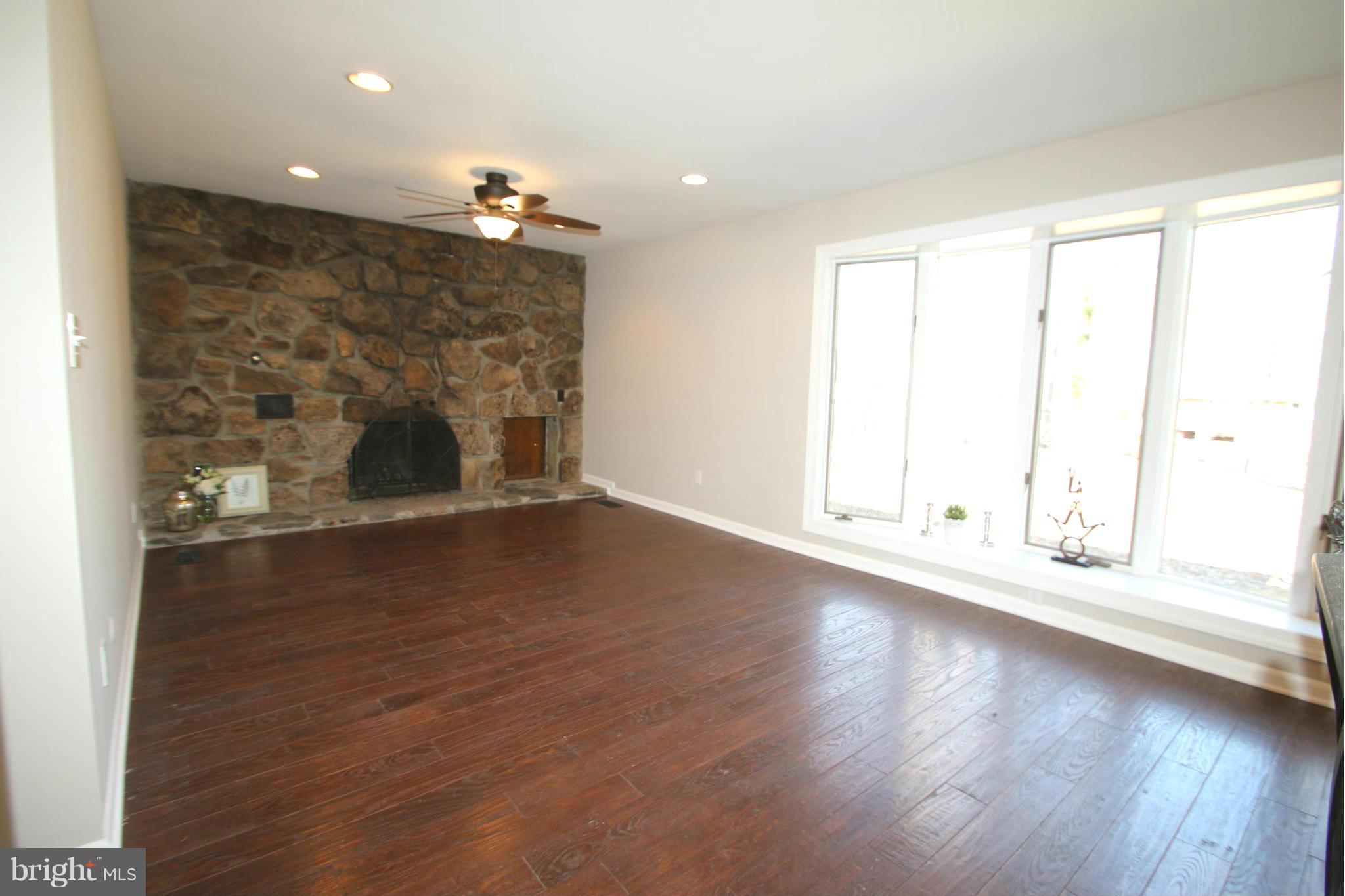 4321 Oaktree Road Rockville, MD 20853 - Photo 6 of 24 a view of empty room with wooden floor and fan