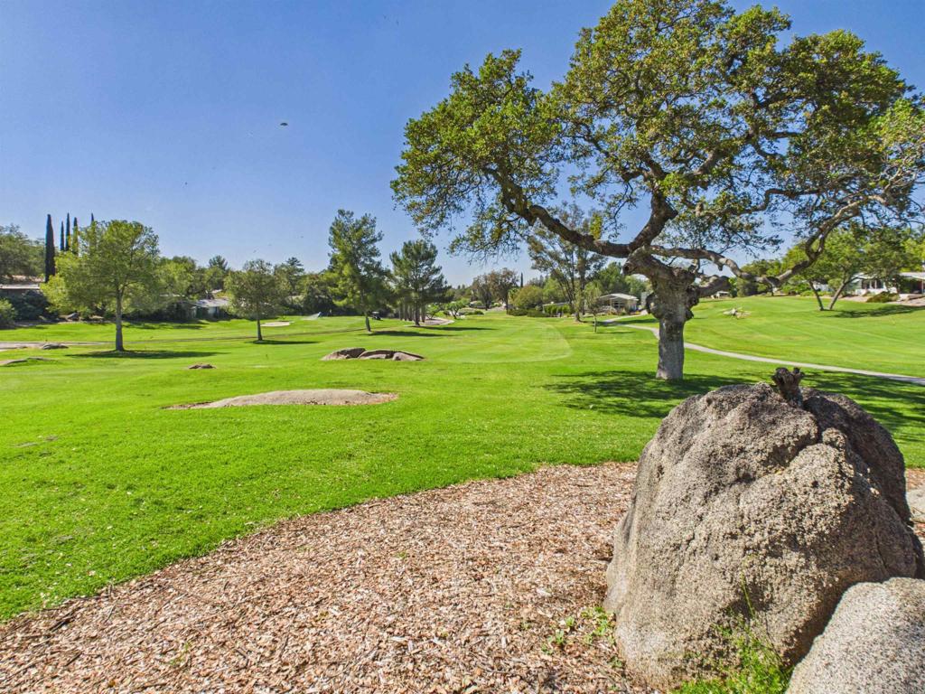 18218 Paradise Mountain Road, Unit 220 Valley Center, CA 92082 - Photo 25 of 48 a view of a park with large trees