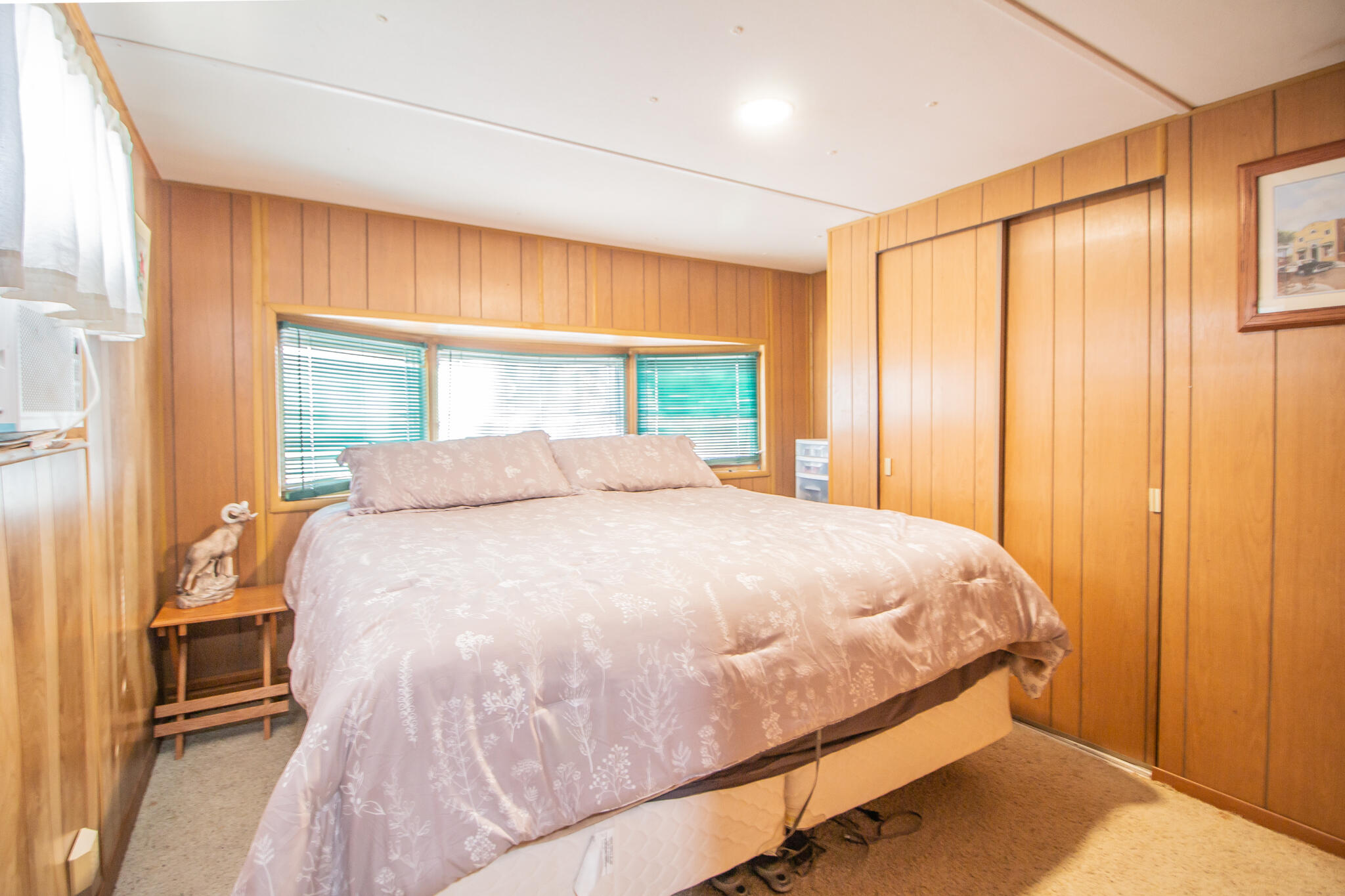 17 Eastwood Road Spur, TX 79370 - Photo 19 of 27 a large bed sitting in a bedroom next to a window