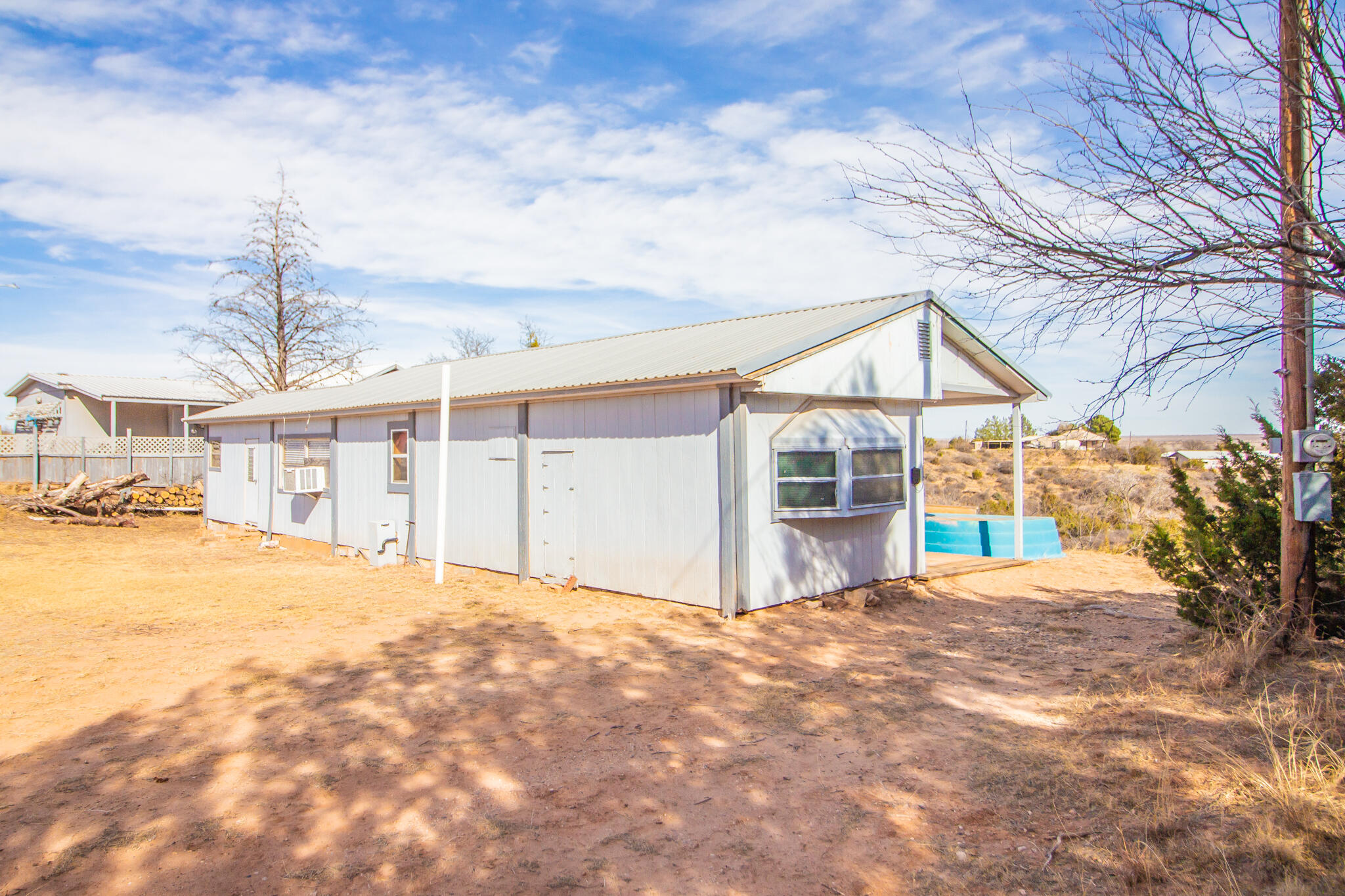 17 Eastwood Road Spur, TX 79370 - Photo 26 of 27 a view of a house with a yard and garage
