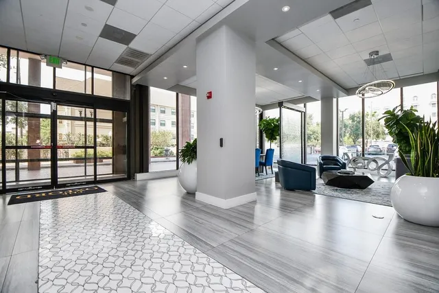 a view of a living room and a balcony