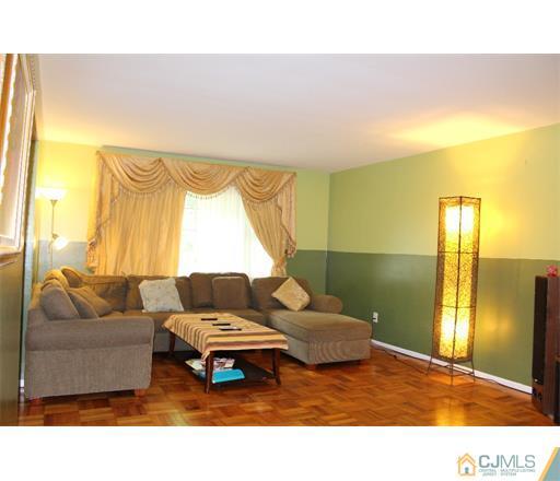 21 Chandler Road Edison, NJ 08820 - Photo 2 of 20 a living room with couches and a coffee table