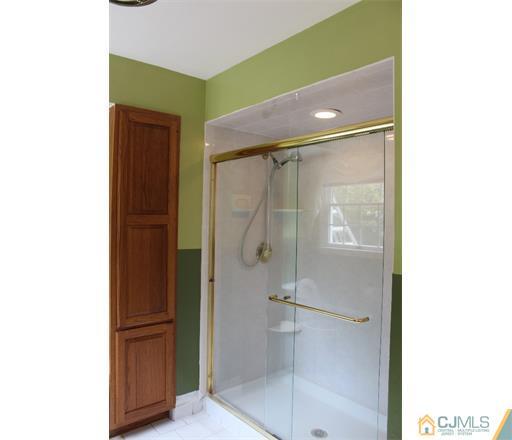 21 Chandler Road Edison, NJ 08820 - Photo 14 of 20 a bathroom with a shower