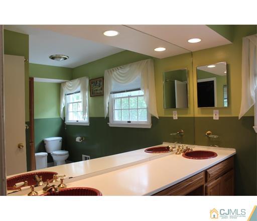21 Chandler Road Edison, NJ 08820 - Photo 15 of 20 a bathroom with a sink double vanity and a mirror