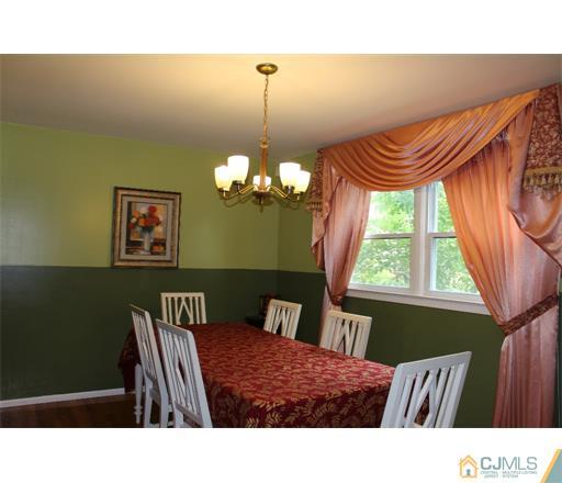 21 Chandler Road Edison, NJ 08820 - Photo 4 of 20 a living room with a bed furniture and a window