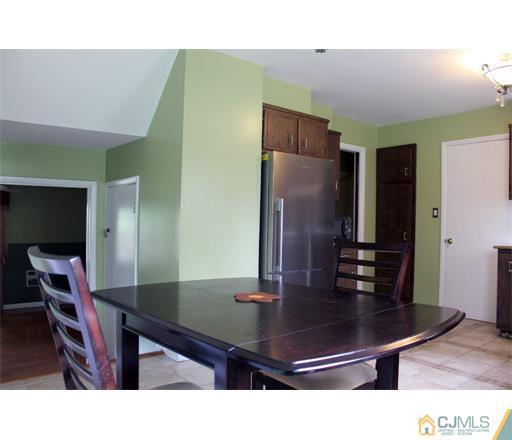 21 Chandler Road Edison, NJ 08820 - Photo 7 of 20 a room with furniture and wooden floor