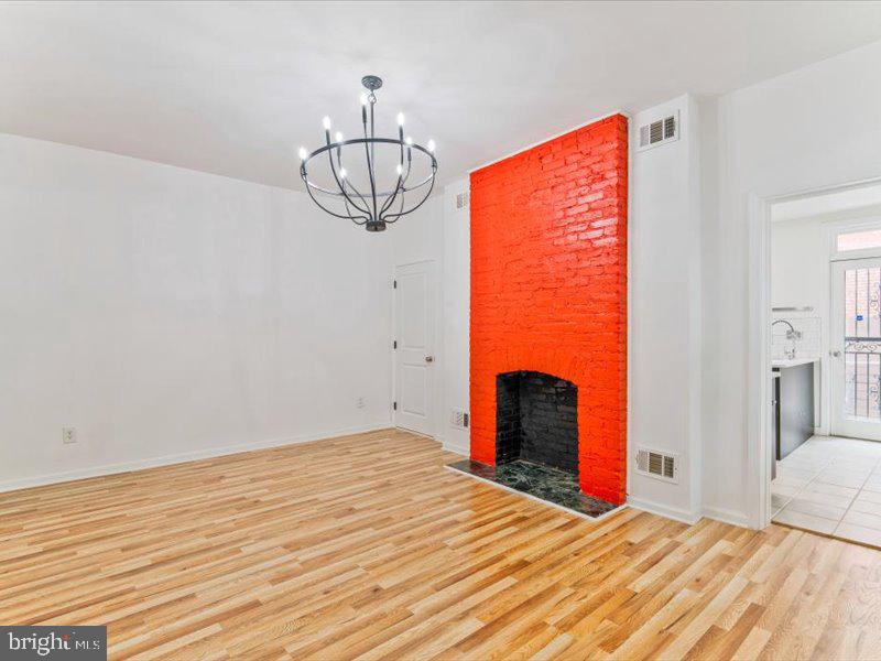 1200 D Street Northeast Washington, DC 20002 - Photo 3 of 47 Vibrant red accent wall in bright space.