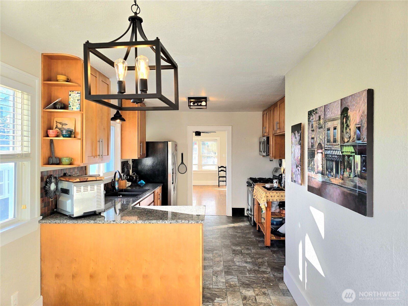 906 North Rice Street Aberdeen, WA 98520 - Photo 13 of 34 a living room with furniture a flat screen tv and a table