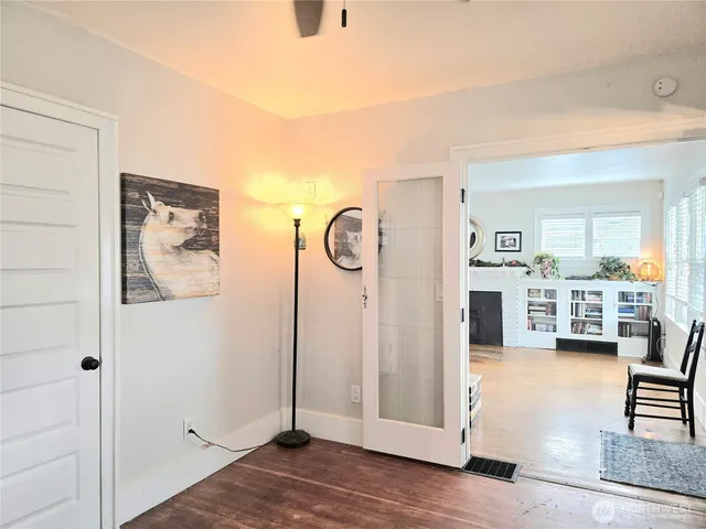 a view of a livingroom with furniture and hardwood floor