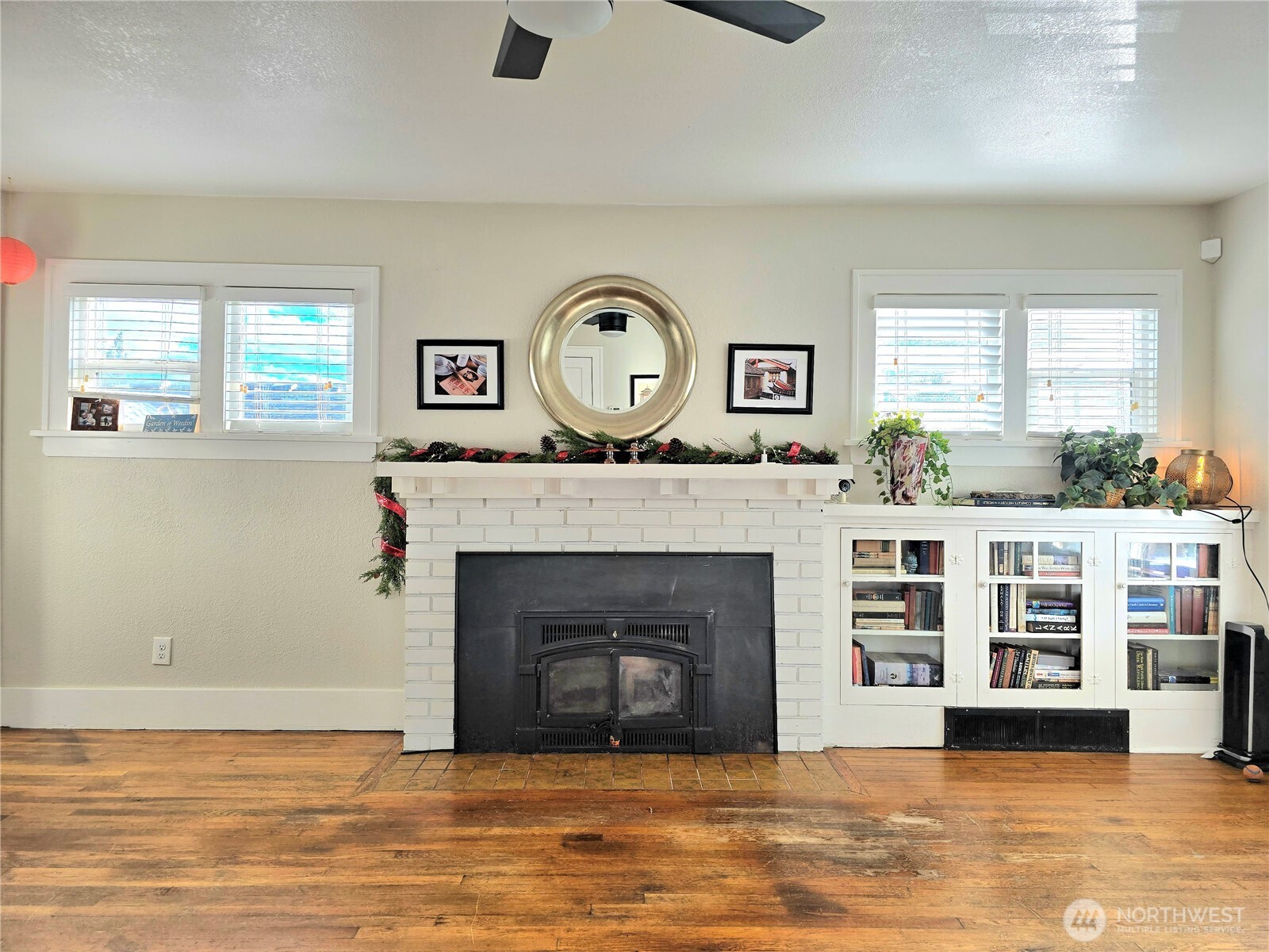 906 North Rice Street Aberdeen, WA 98520 - Photo 6 of 34 a living room with a fireplace furniture a large window and a fireplace