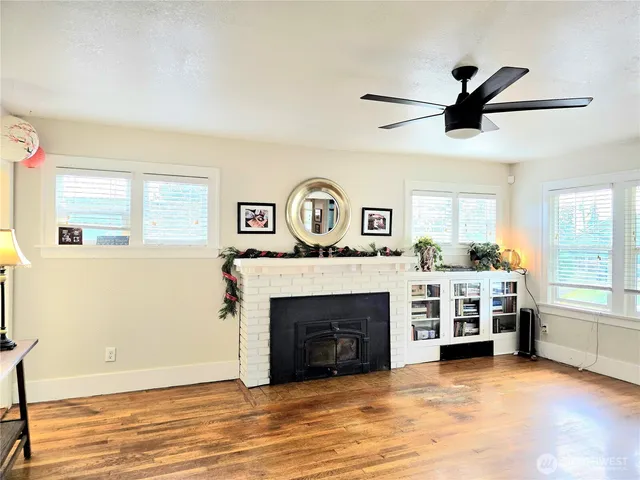 a living room with a fireplace and a window