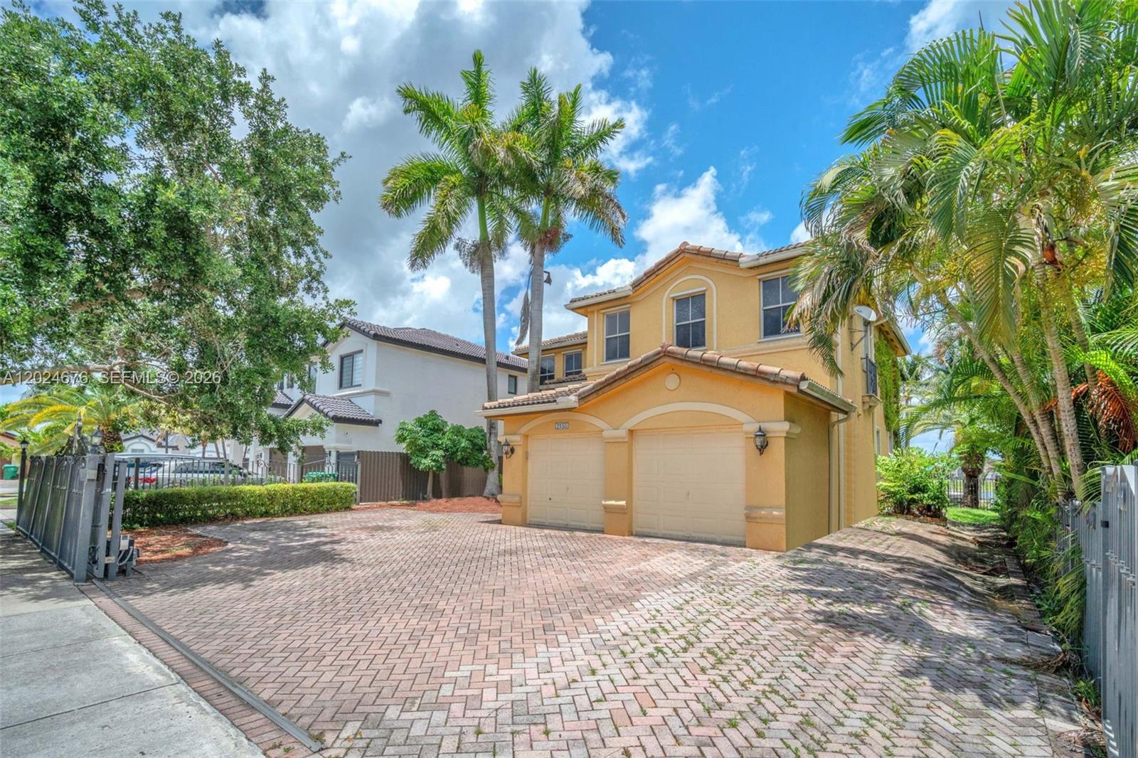2155 Southwest 156th Court Miami, FL 33185 - Photo 4 of 57 a front view of a house with a yard and garage