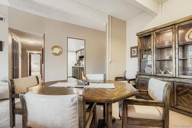 a view of a dining room with furniture and window