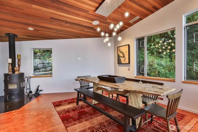 a view of a dining room with furniture window and outside view