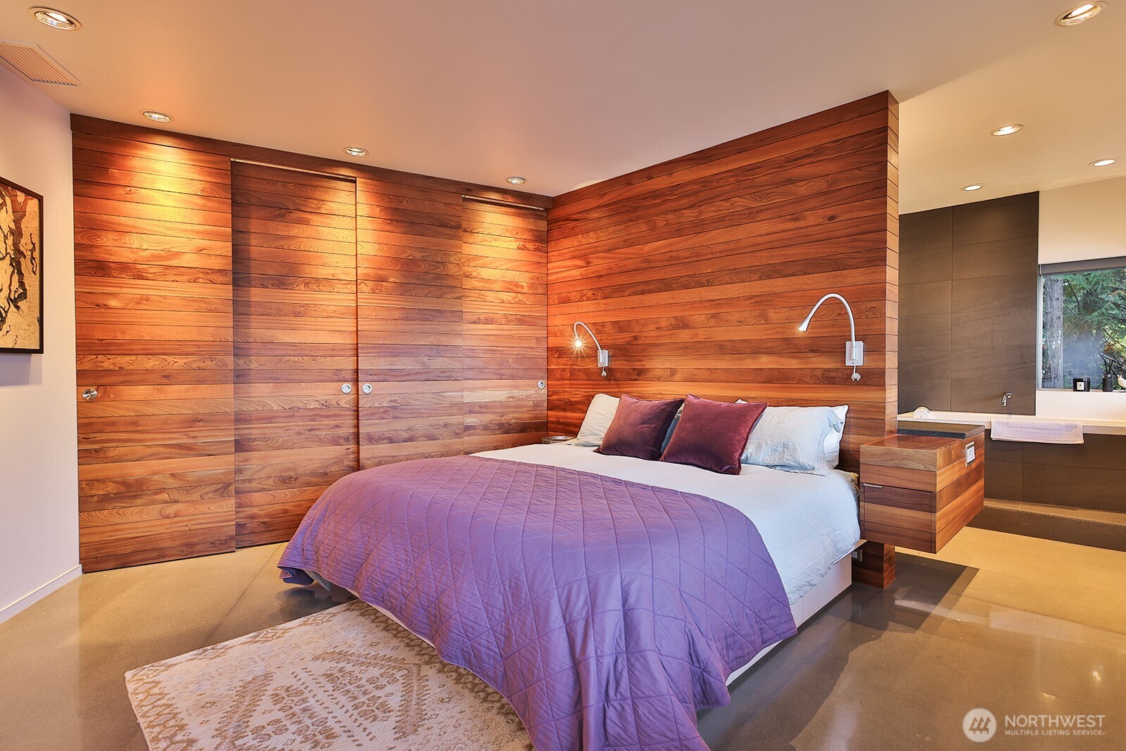 15810 Cedar Brae Road Leavenworth, WA 98826 - Photo 17 of 40 a bedroom with a bed and wooden floor