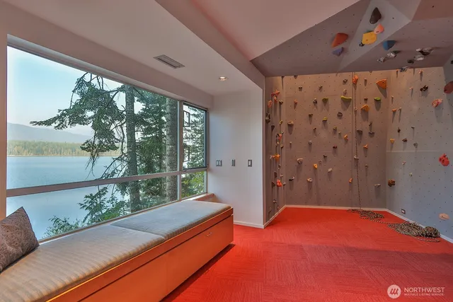 a bedroom with a bed and a night stand