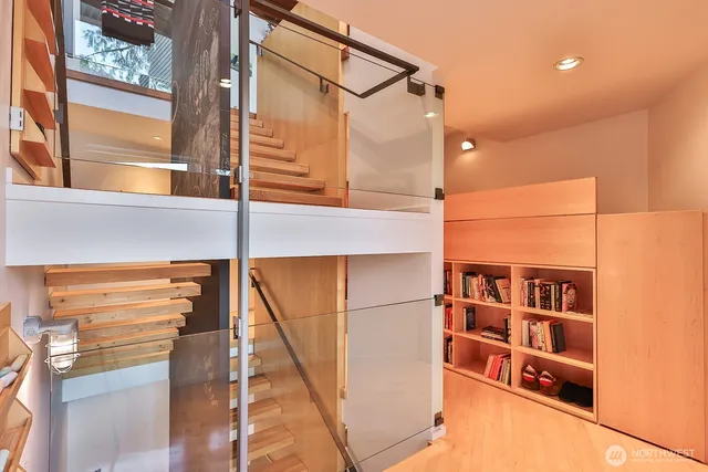 a room with furniture pool table and windows