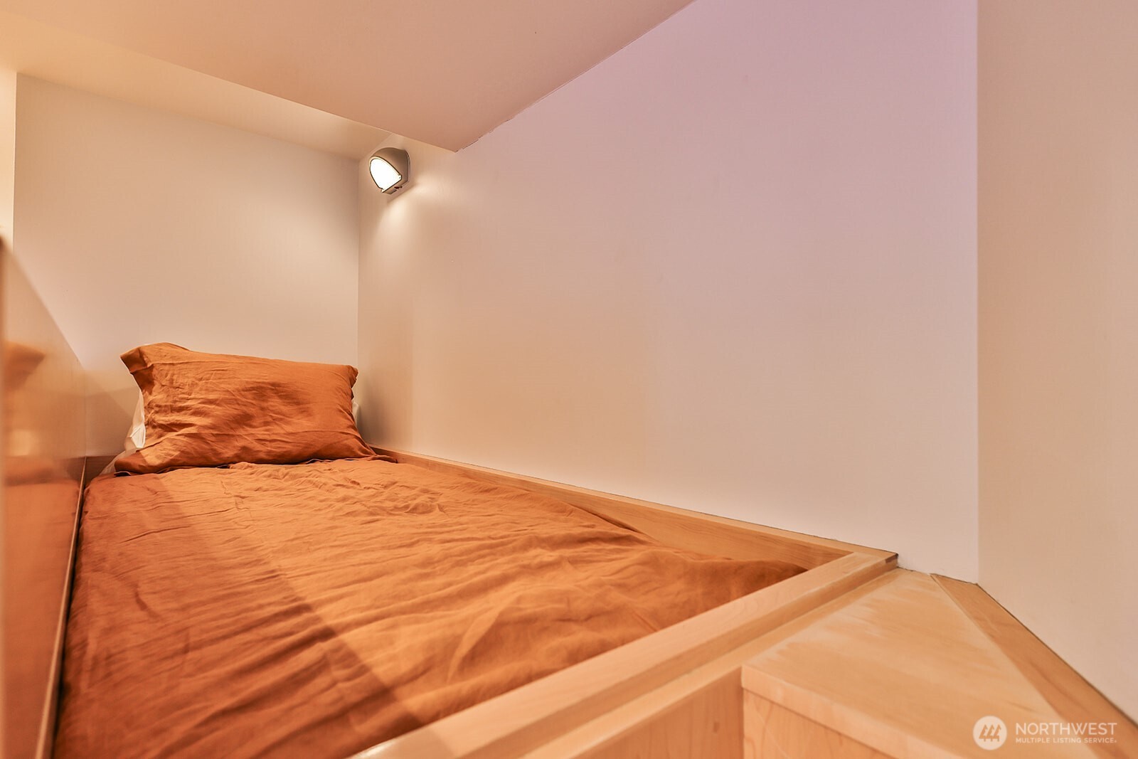 15810 Cedar Brae Road Leavenworth, WA 98826 - Photo 26 of 40 a bedroom with a bed and a night stand