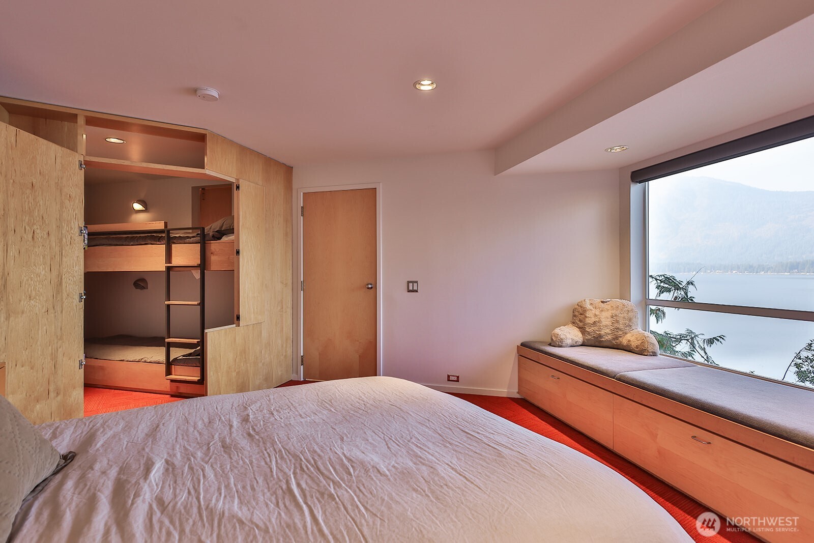 15810 Cedar Brae Road Leavenworth, WA 98826 - Photo 29 of 40 a bedroom with a bed and a flat screen tv