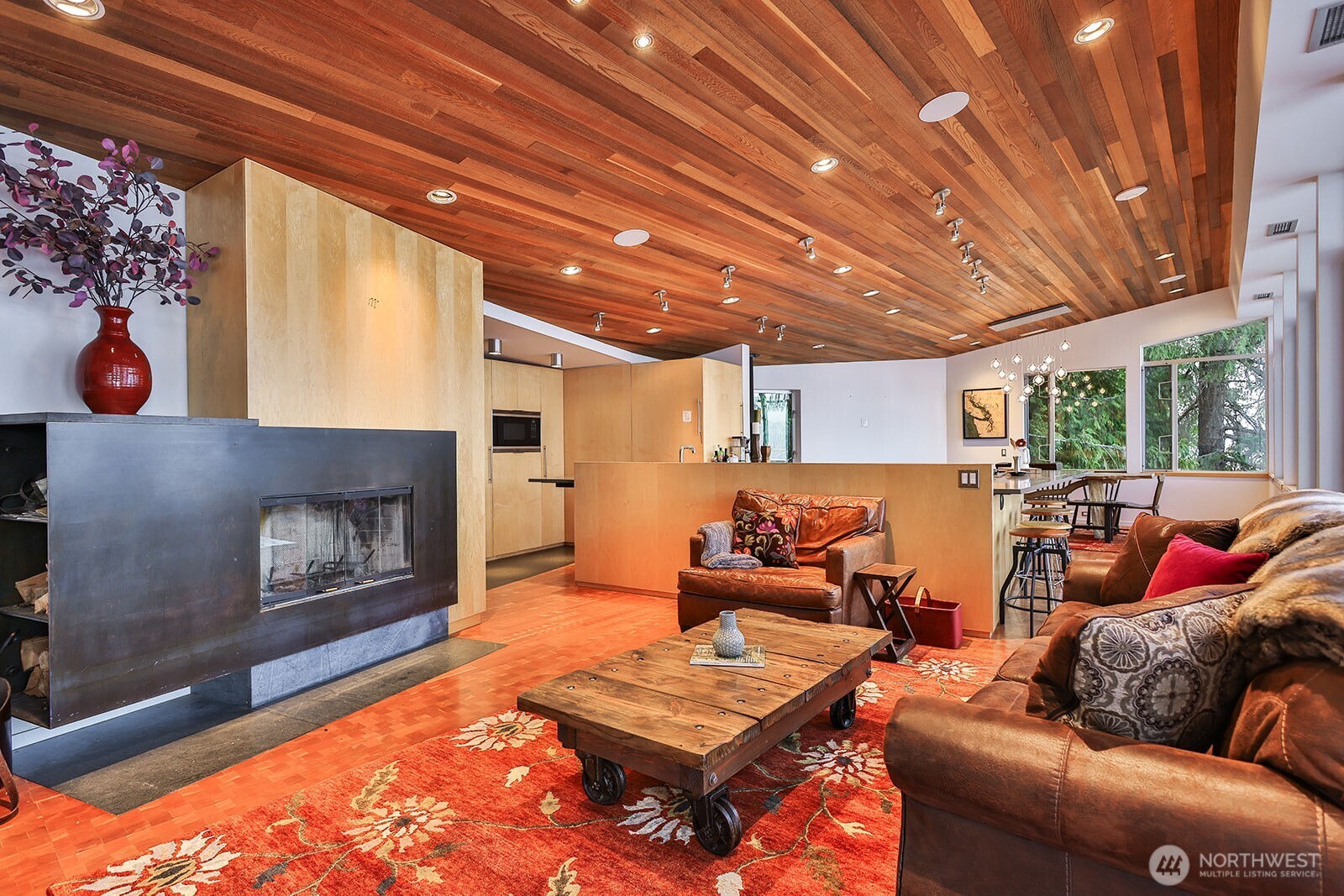 15810 Cedar Brae Road Leavenworth, WA 98826 - Photo 9 of 40 a living room with furniture a fireplace and a table