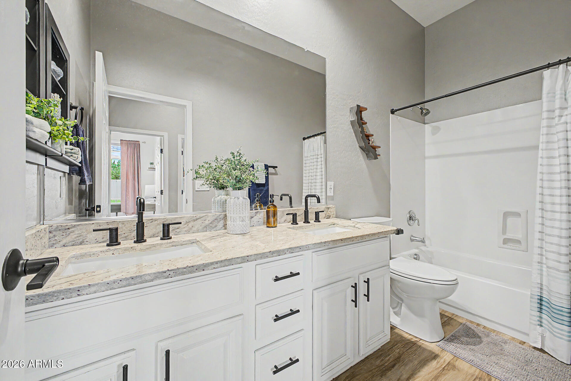 4272 East Buckboard Road Gilbert, AZ 85297 - Photo 30 of 37 a bathroom with a double vanity sink and a mirror