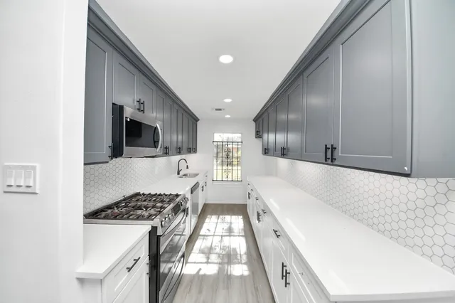 a spacious bathroom with a tub and a sink